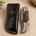 Engraved Damascus-Style Folding Knife with Wooden Handle & Leather Sheath